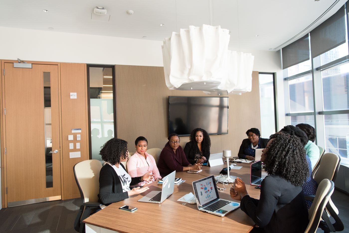 A student presenting her pitch to a group of peers